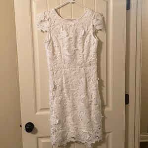 White lacy dress. Never worn. Would be perfect for Wedding events for bride